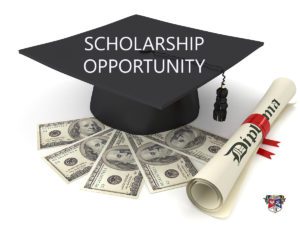 Student’s graduation cap resting on top of five $100 bills and a rolled-up graduate diploma with red ribbon